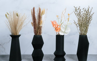 Four black vase modern designs by Woodland Pulse - a seller of black vases, unique flower pots, and modern planters made in the USA.