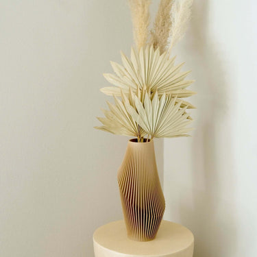 Nova Luxe vase by Woodland Pulse with dried palm leaves and pampas grass.