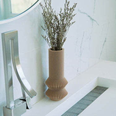 A small vase from Woodland Pulse. This is a cream color vase from the Woodland Pulse boho vases collection.