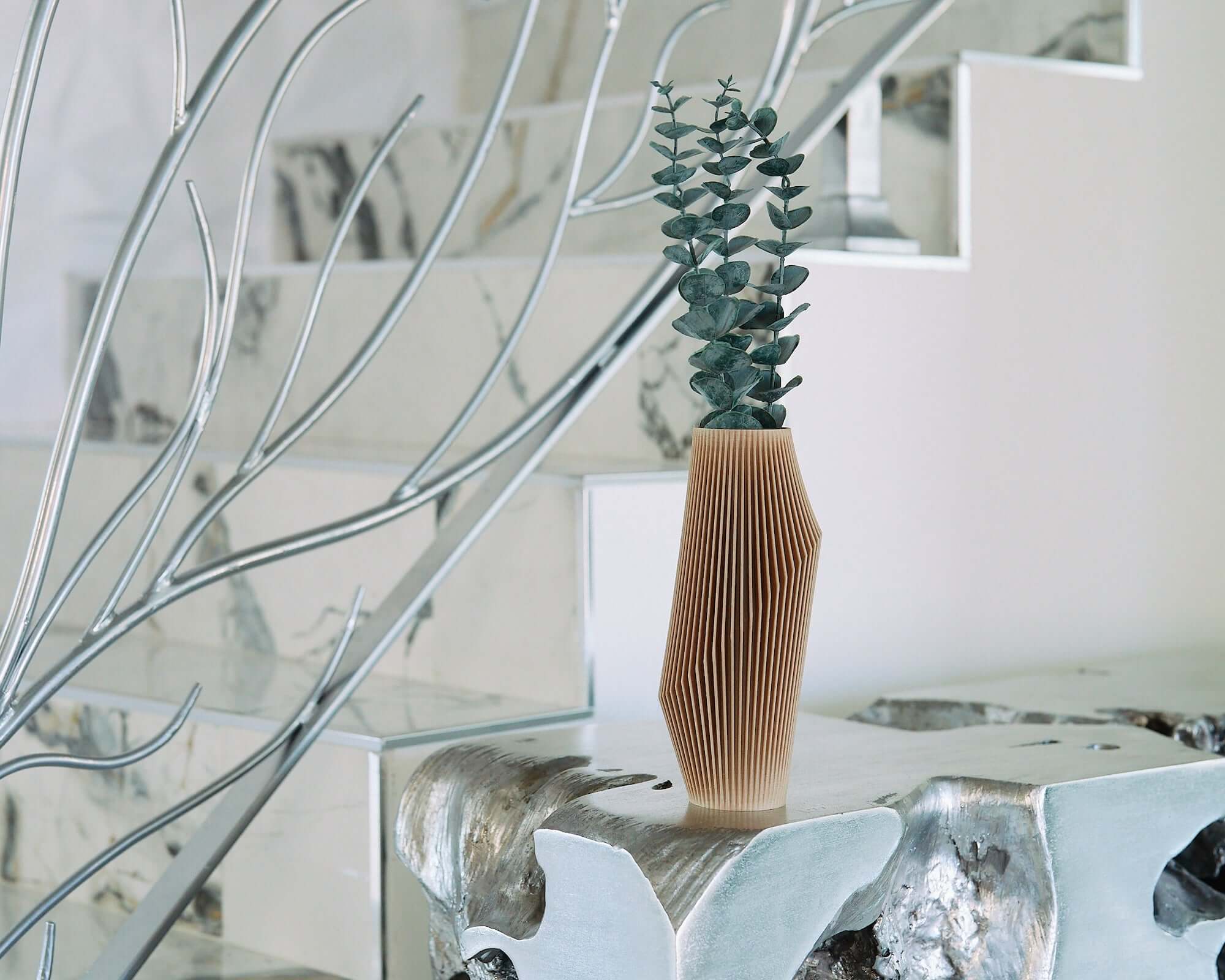 Unique vase with eucalyptus.
