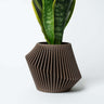 A Woodland Pulse's boho planter. This is a brown planter.