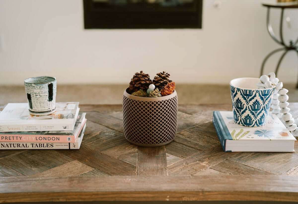Modern planters, Unique Planters, Decor Planters from Woodland Pulse. A decor planter on a living room table with pinecones.
