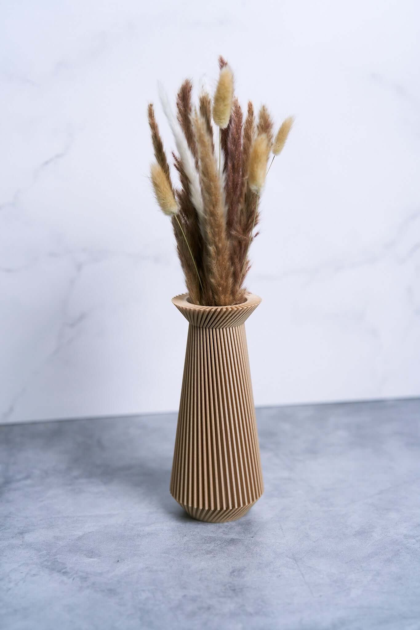 A beige vase / modernist vase with pampas grass by Woodland Pulse. This is a boho vase / modern vase.
