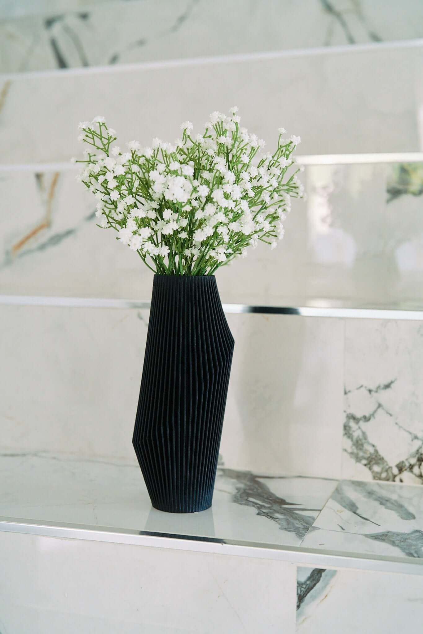 NOVA Black Textured Vase with white flowers.