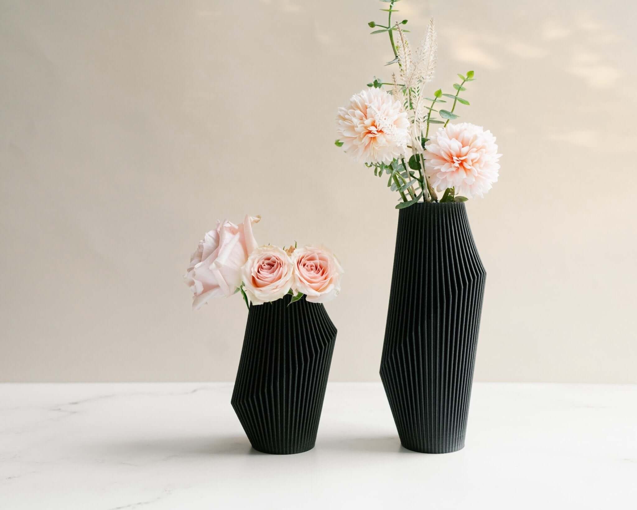 Two NOVA modern vases with flowers.