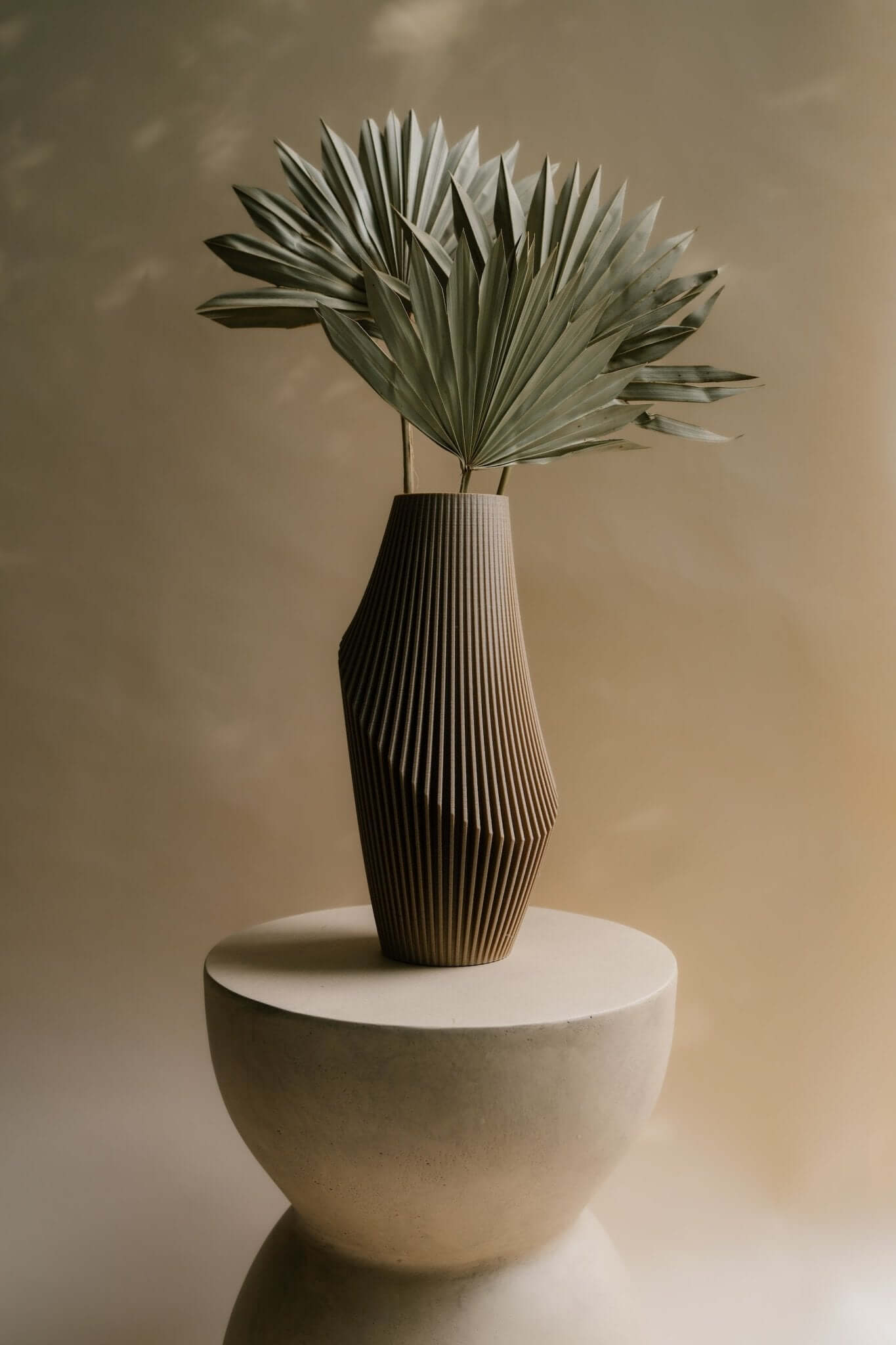 Nova Luxe vase by Woodland Pulse with dried palm leaves.