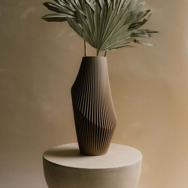 Nova Luxe vase by Woodland Pulse with dried palm leaves.